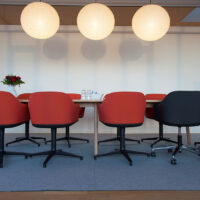 sound-absorbing felt rug under conference table and chairs in office