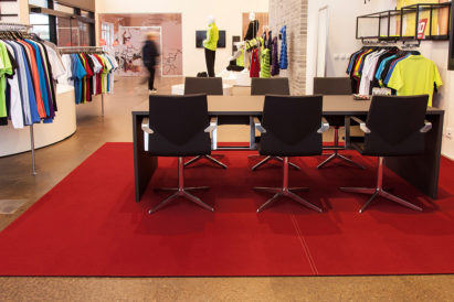 felt rug with table and chairs in clothing store