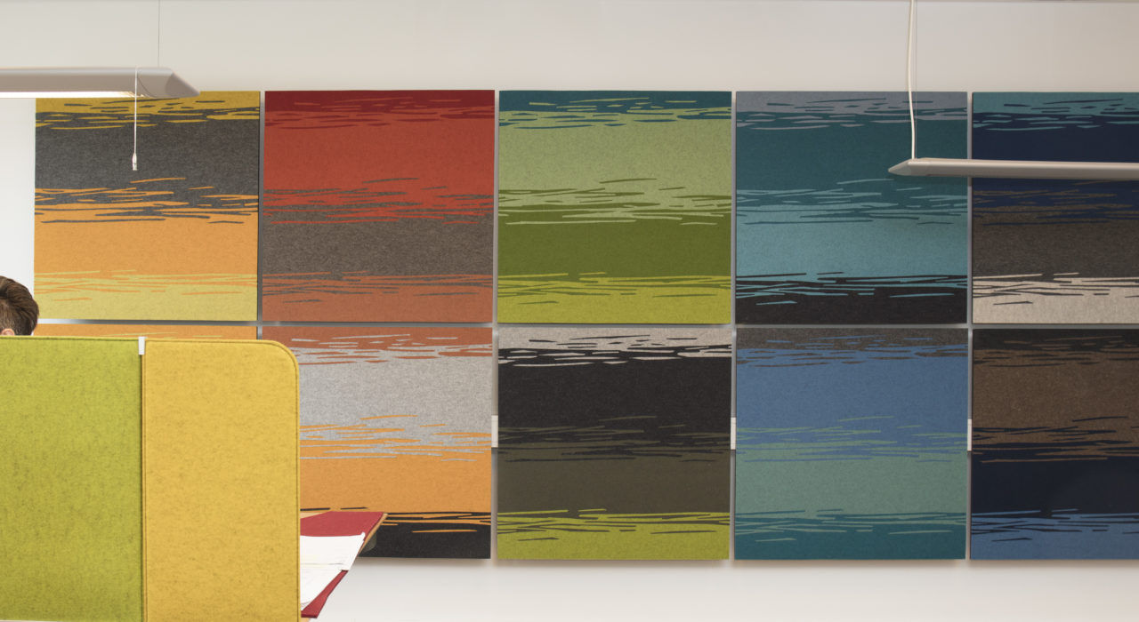 colorful hand-cut wool felt acoustic tiles on office wall