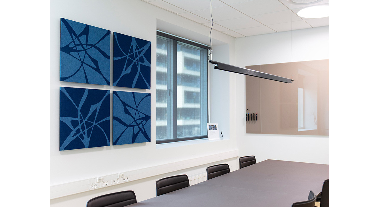 light and dark blue acoustic wall panels installed on office wall behind conference table