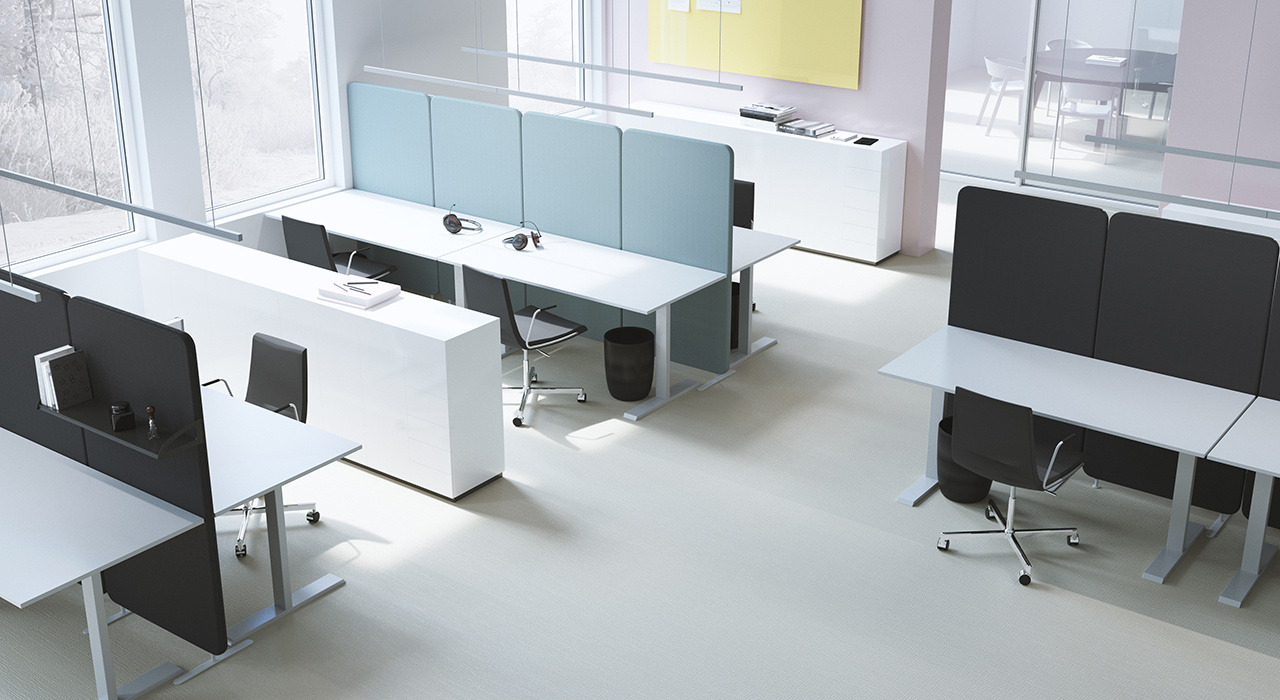 dark colored acoustic floor screens dividing several tables in office