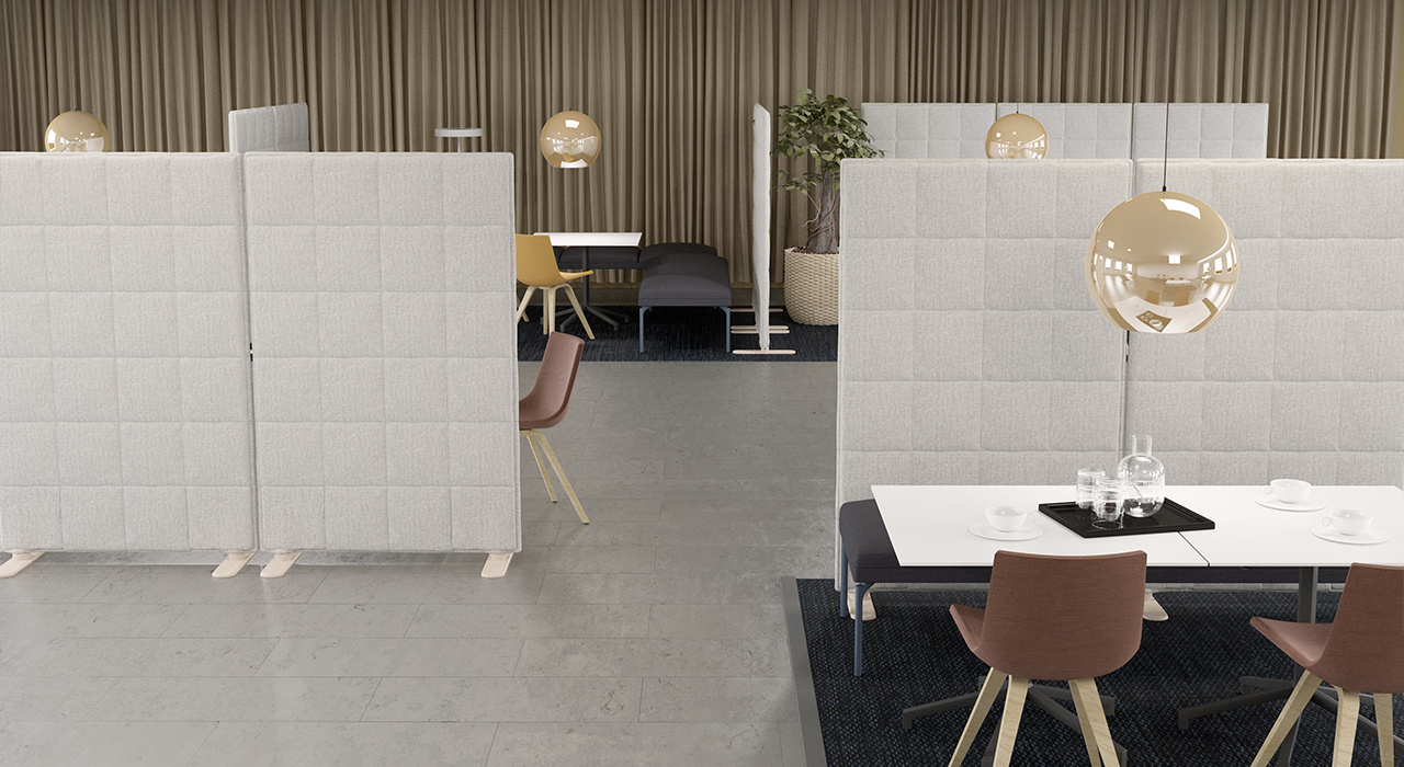 light grey acoustic floor screens dividing an office