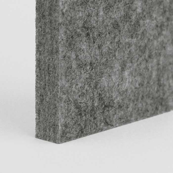 corner of a dark grey acoustic panel