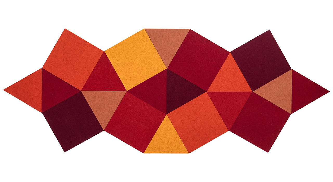 cut felt shaped acoustic tiles in red orange yellow and maroon grouped together