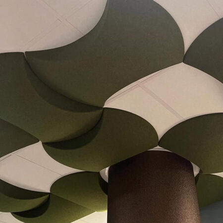 dark green acoustic ceiling tiles designed as leaves of a tree