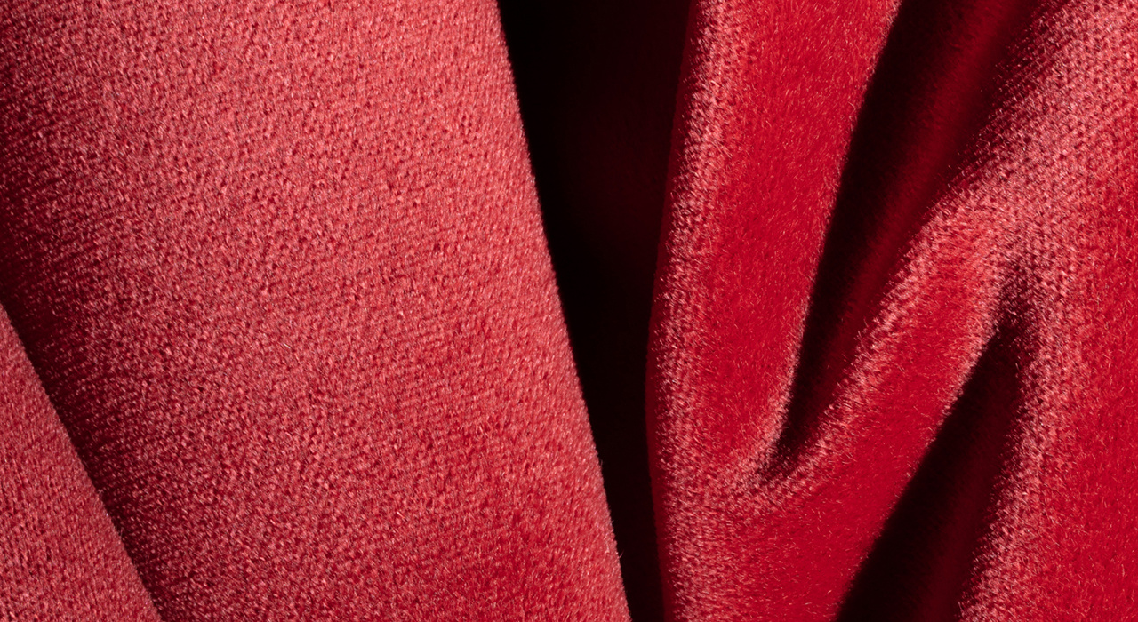 red velvety faced mohair upholstery textile scrunched up