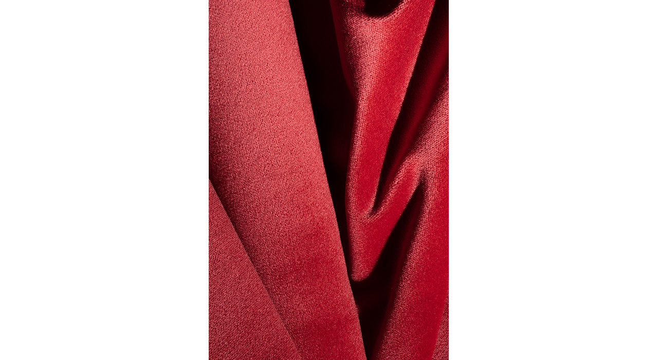 red velvety mohair faced upholstery textile scrunched up hero