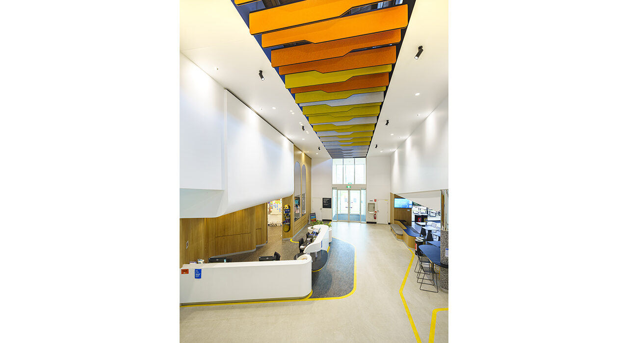 orange yellow and white baffles above office reception area