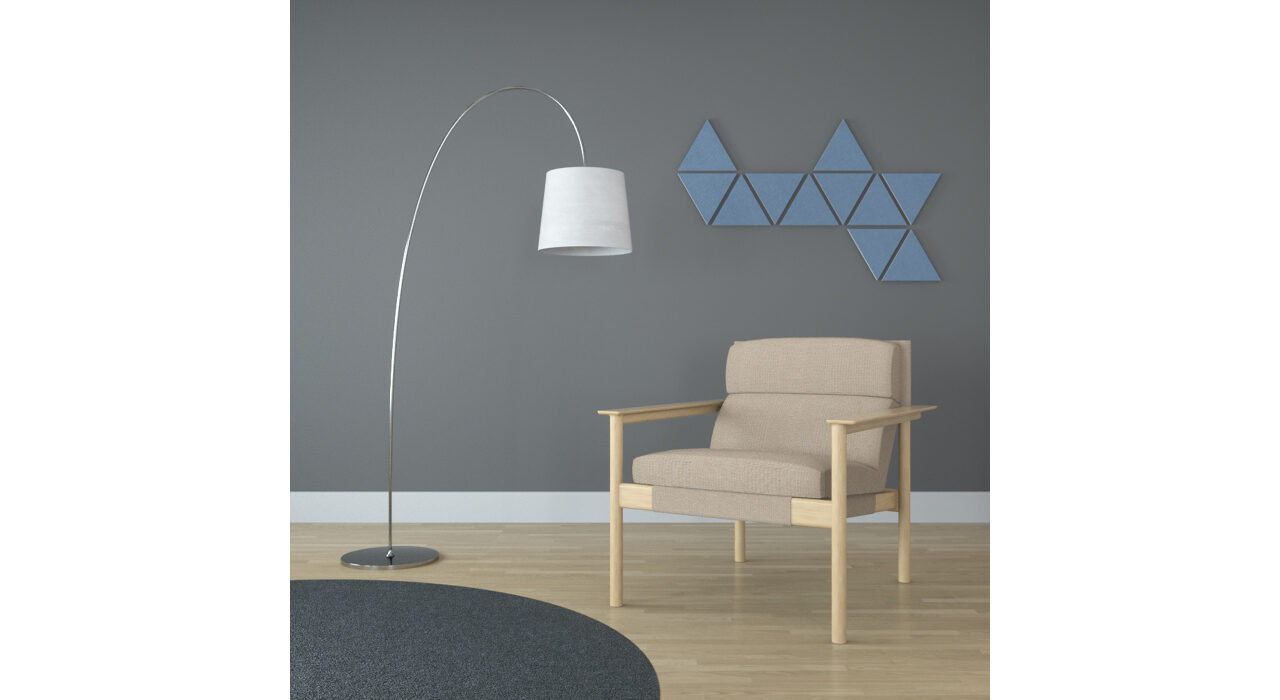 light blue triangle shaped sound absorbing self stick tiles on wall behind chair