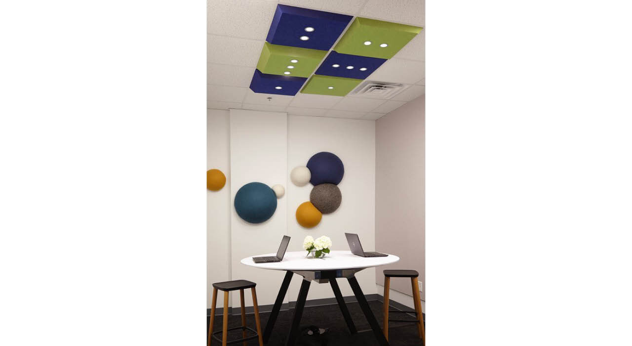 blue and green acoustic LED tiles above table