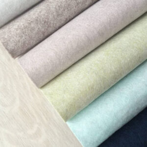 colorful felt rolled on wooden table
