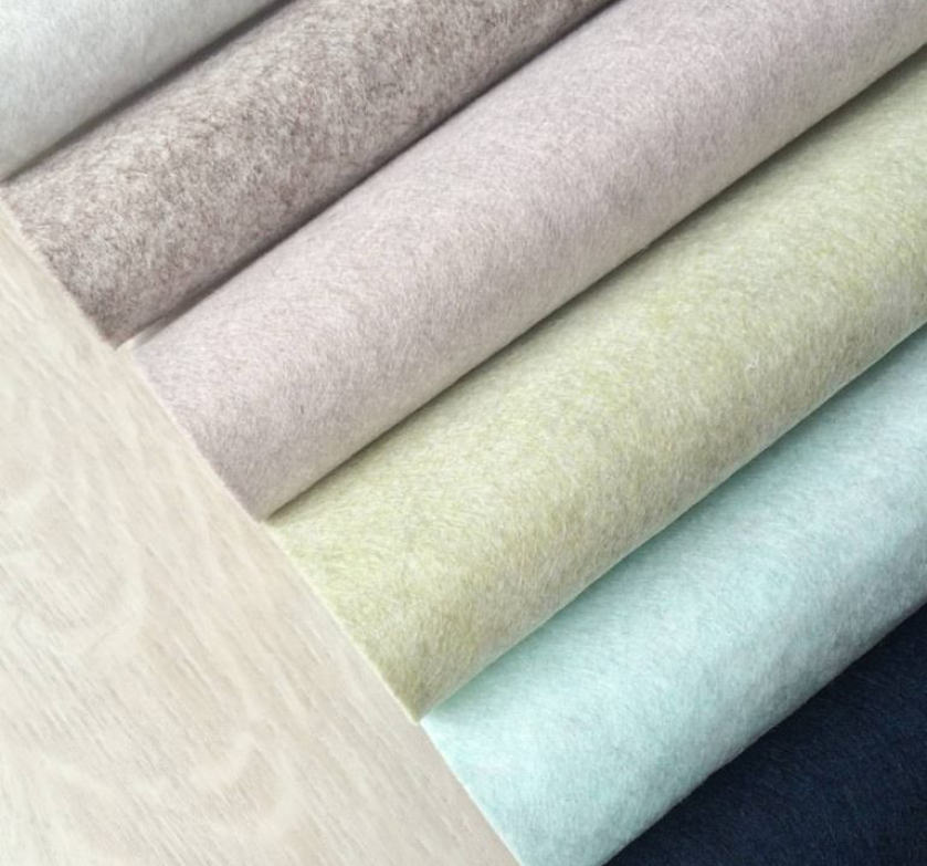 colorful felt rolled on wooden table