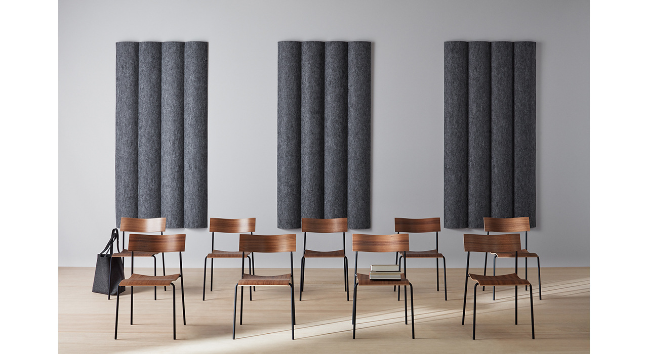 dark grey scala xl convex acoustic tiles on wall behind classroom chairs