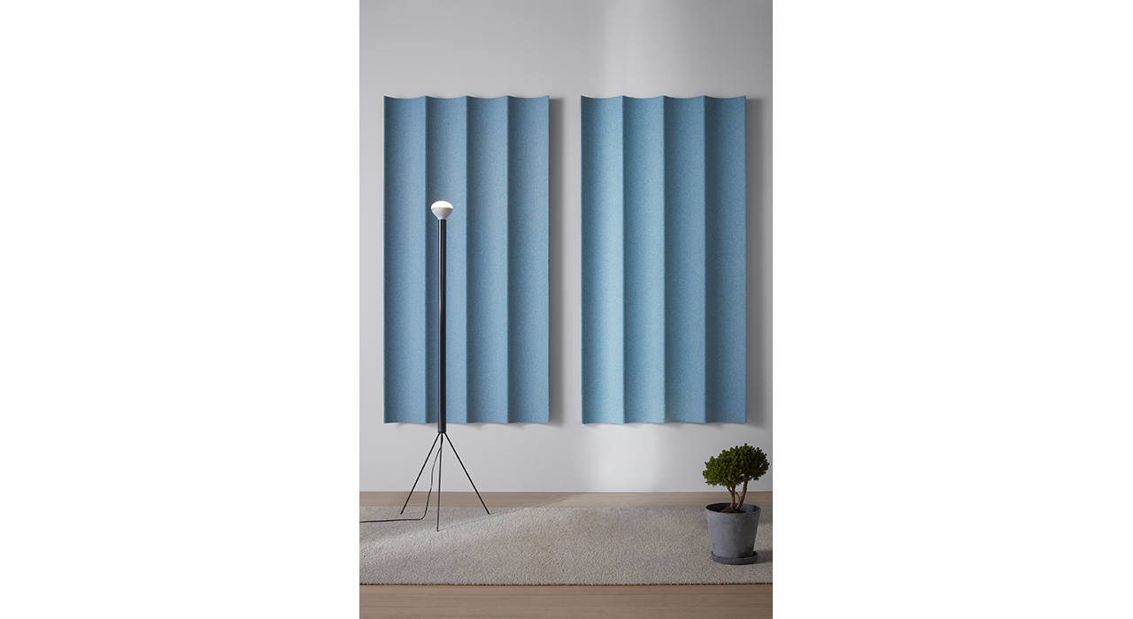 light blue scala xl tiles concave on wall behind lamp and potted plant