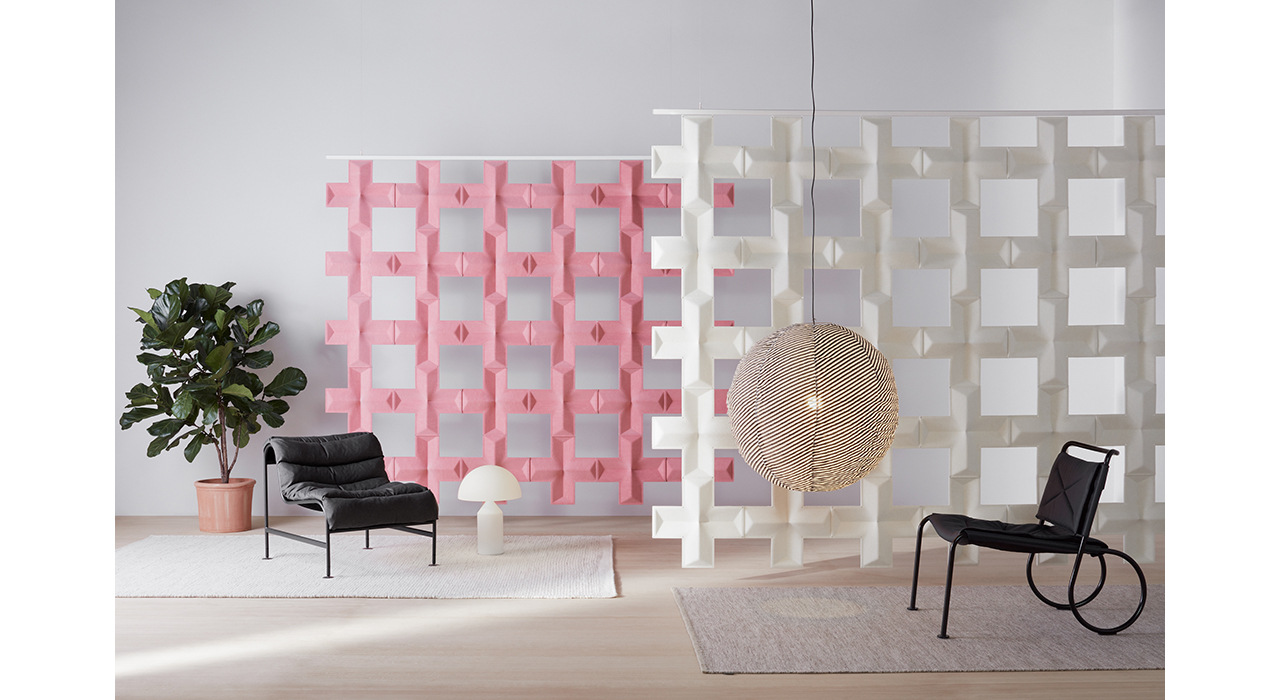 white and pink sound absorbing air x tiles suspended in open room with lamp and seating