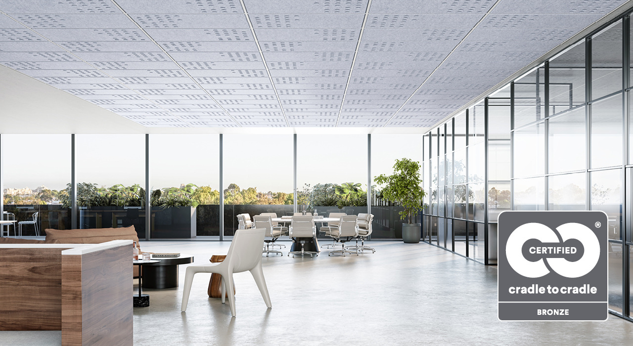off white acoustic drop ceiling tiles in a well lit open office