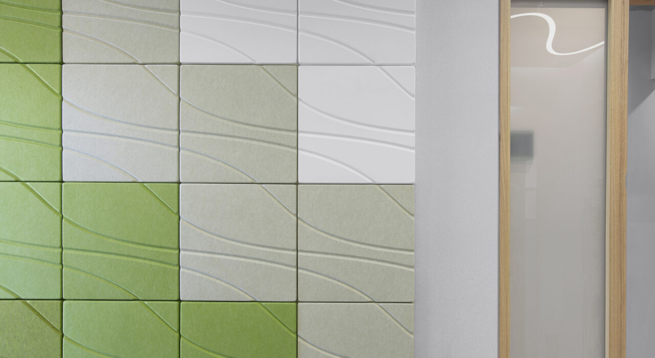 yellow green and white acoustic tiles on exam room wall
