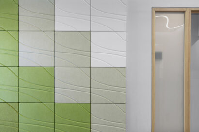 yellow green and white acoustic tiles on exam room wall