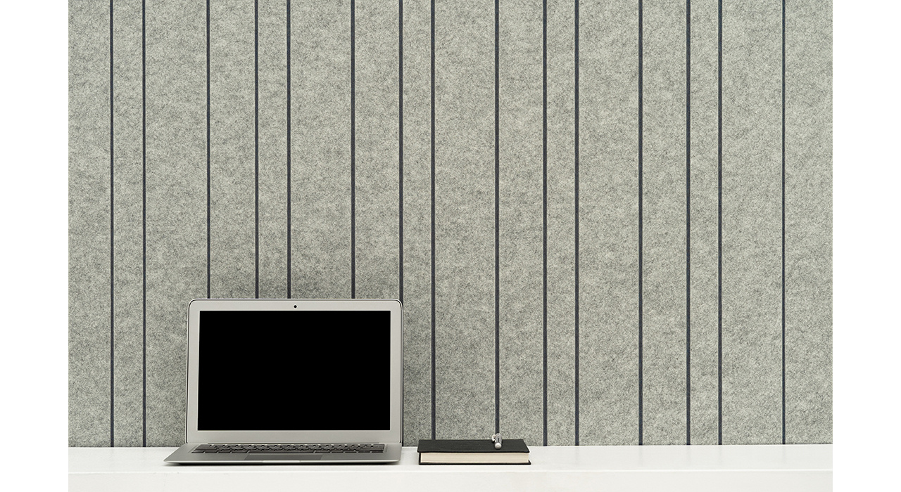 acoustic panels in light grey with a vertical linear pattern