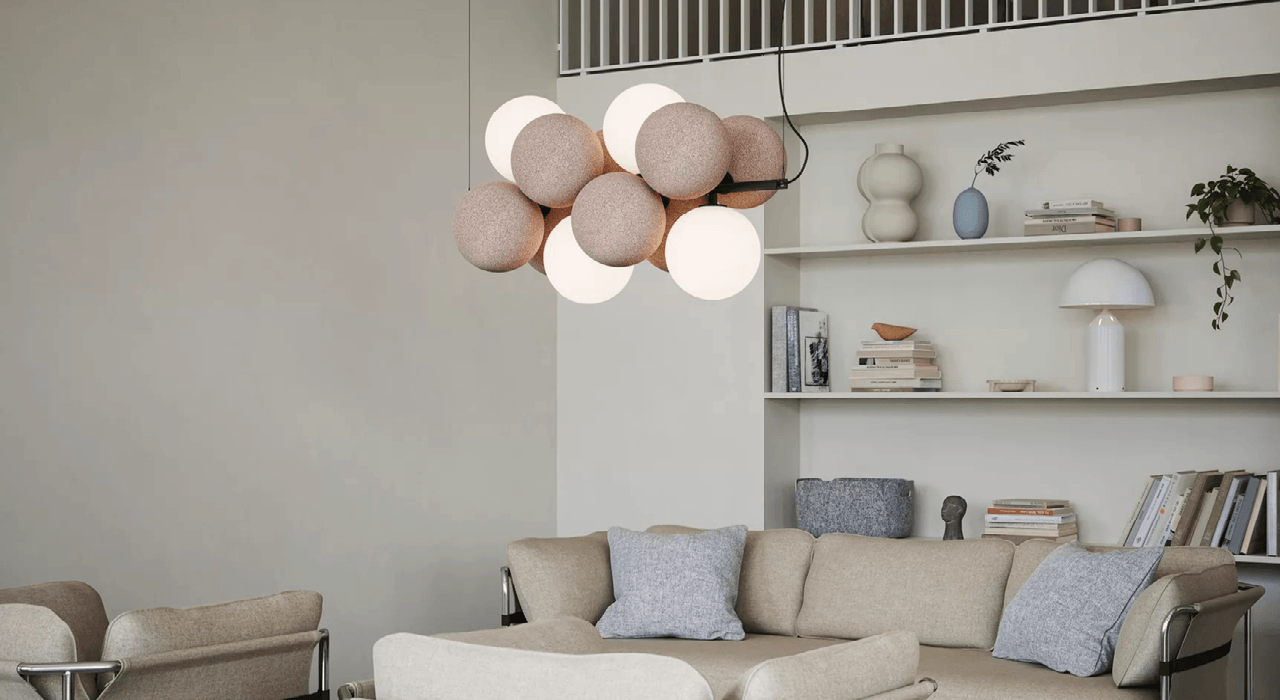 tan acoustic globes with lighting suspended above a living room