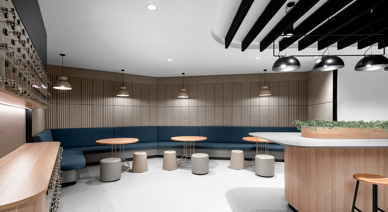 breakout room with banquette seating acoustic wall tiles and sound absorbing ceiling baffles