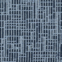 detail of blue upholstery textile with dark blue dot pattern