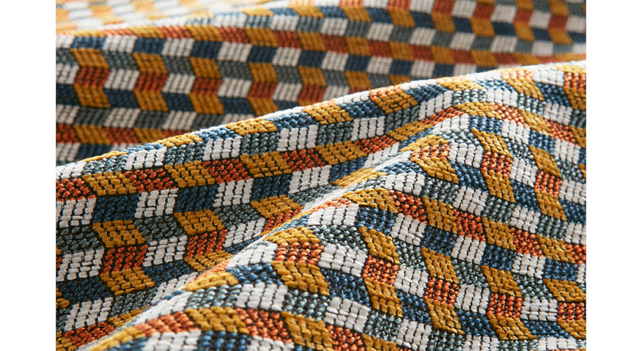 detail of multi-colored upholstery textile with chevron pattern