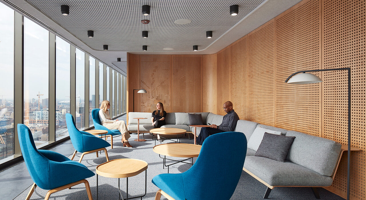 Light grey acoustic panels with perforations on ceiling above seating area