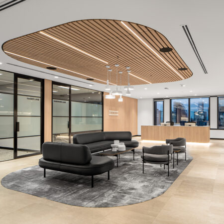 wooden drop ceiling tiles above seating area in office