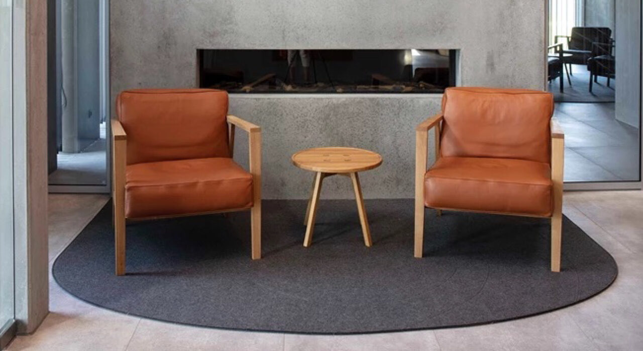 acoustic Fraster Felt Rug featured in Fraster's showroom under lounge seating