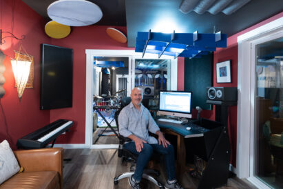 musician seated in a music studio
