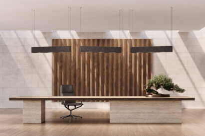 sound absorbing copper patterned panels behind a large desk