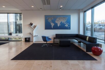dark grey Fraster Felt wool rug under lounge seating in ISS office