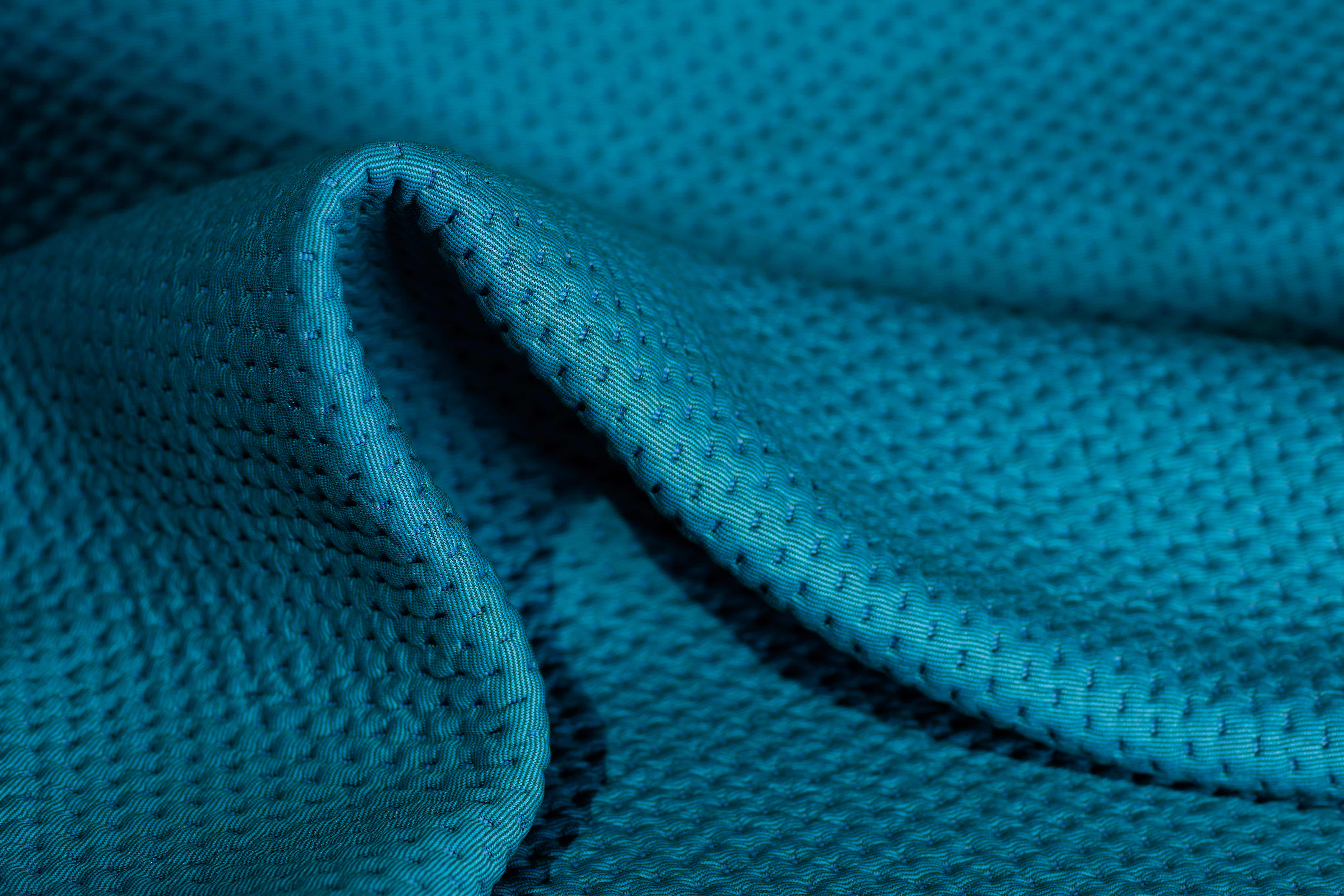 aqua blue upholstery textile with strong light and dark hero